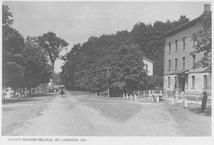 SA0255 - Photo shows a street in a Shaker village with buildings and a buggy. Identified on the front., Winterthur Shaker Photograph and Post Card Collection 1851 to 1921c